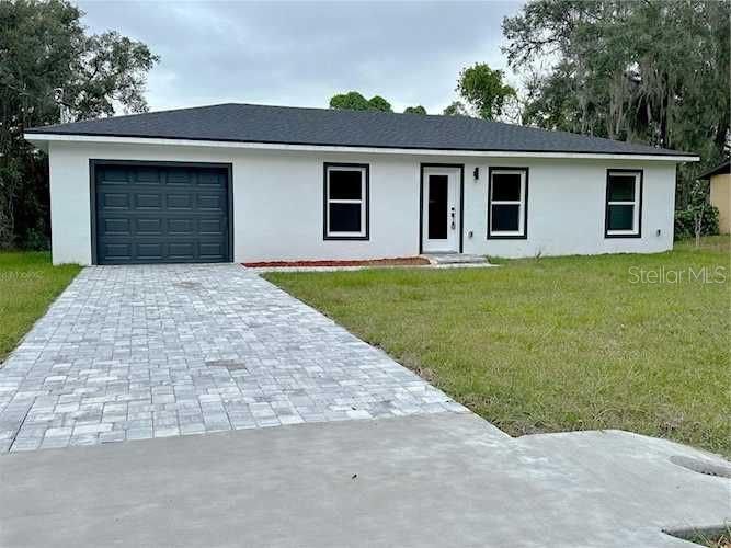 front view of a house with a yard