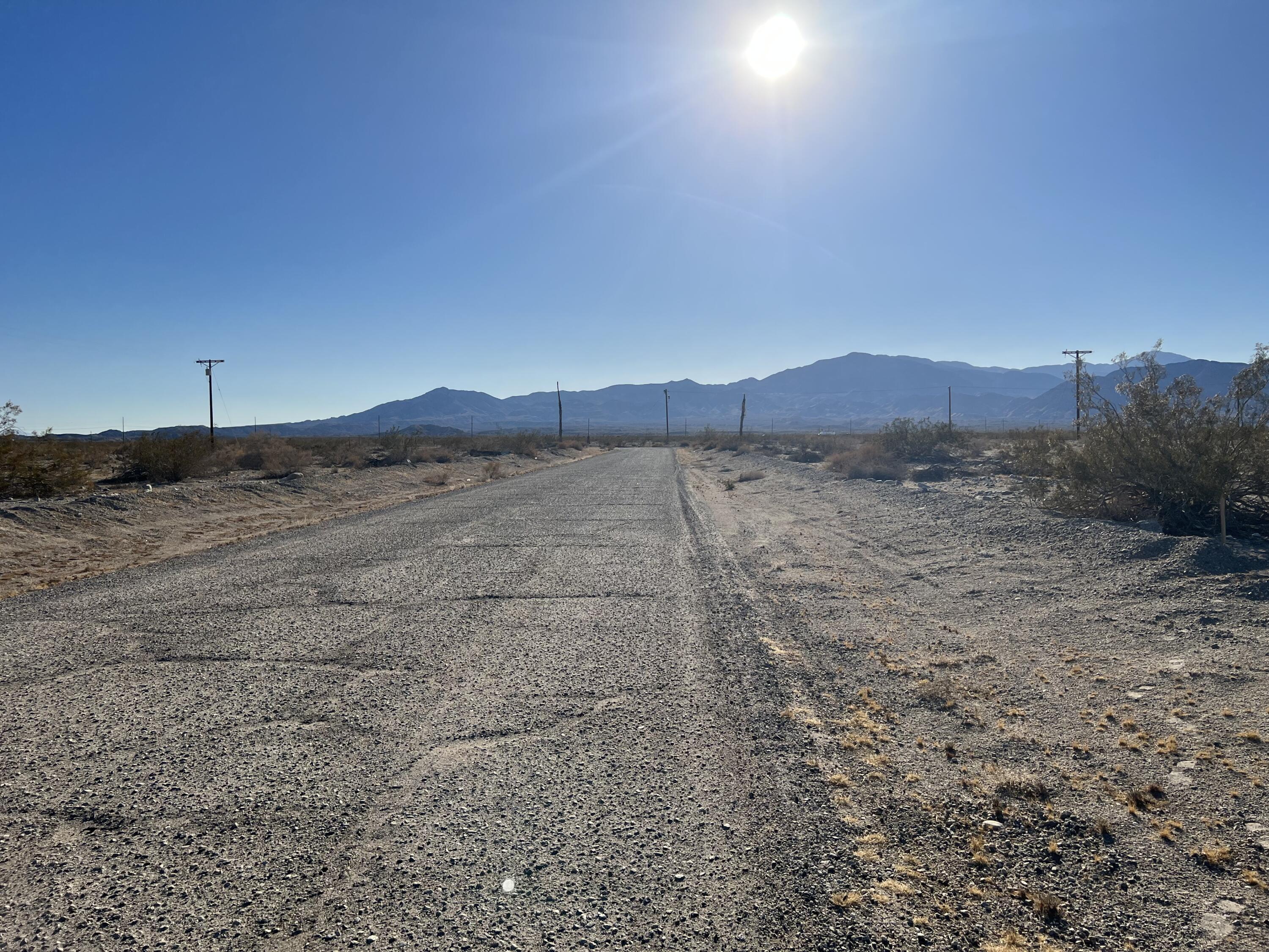 a view of a dry yard with mountain