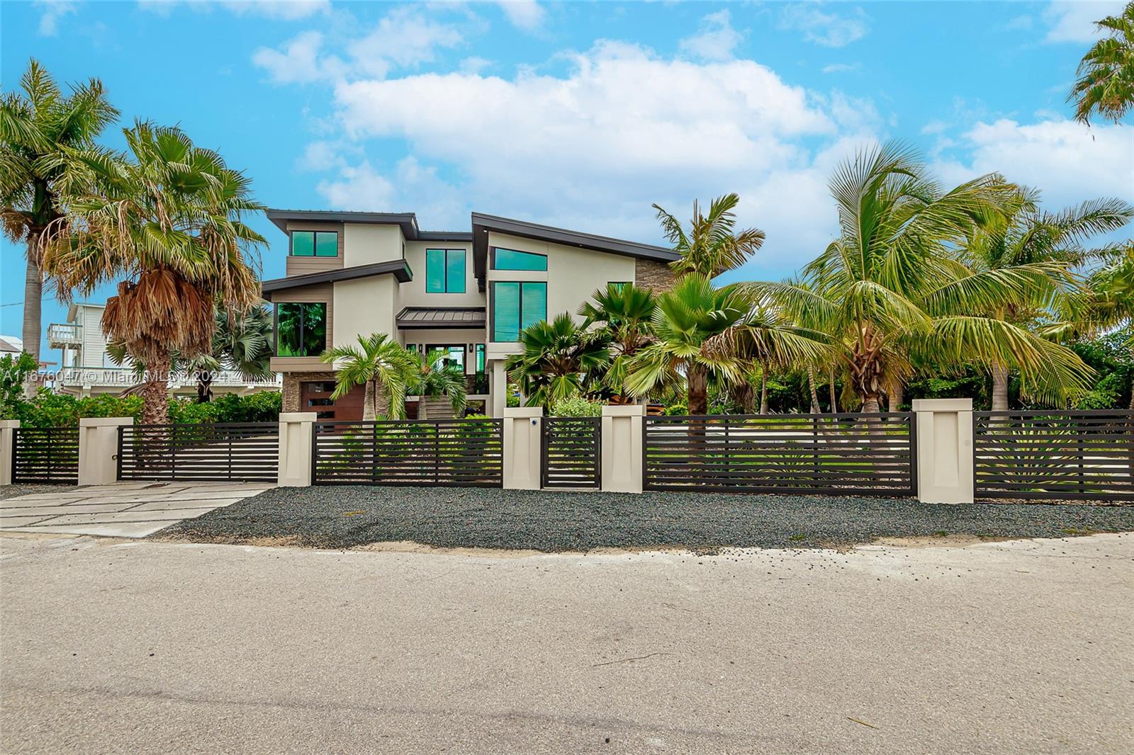 a front view of a house with a yard and a garage