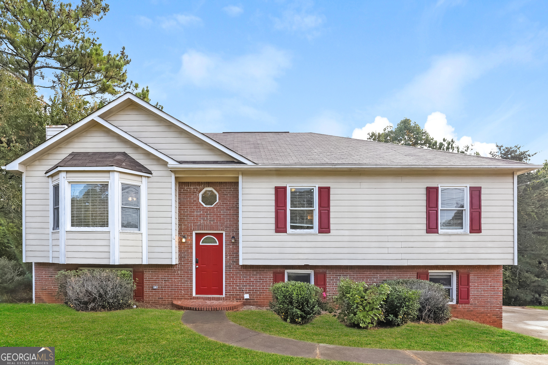 a front view of a house with a yard