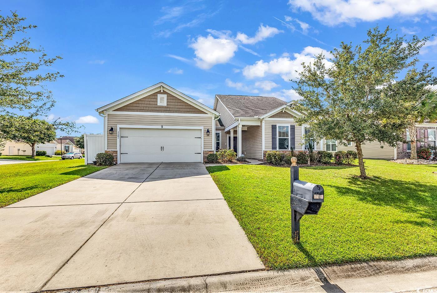 View of front of house featuring a front lawn and