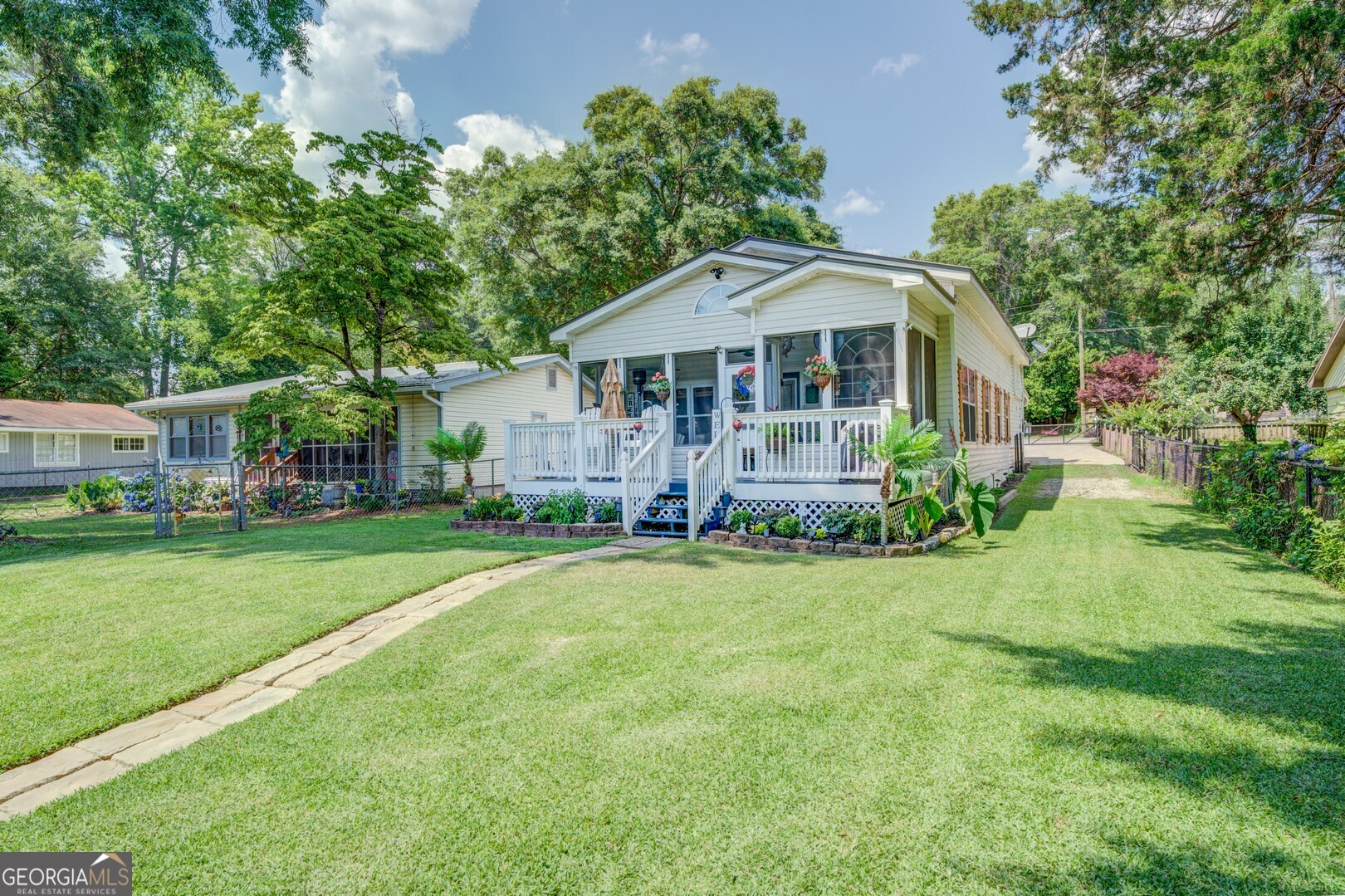 a front view of a house with garden