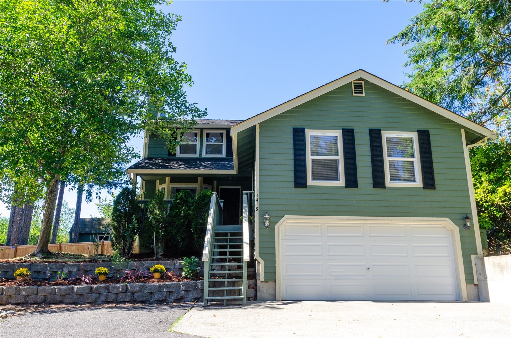 a front view of a house with garage