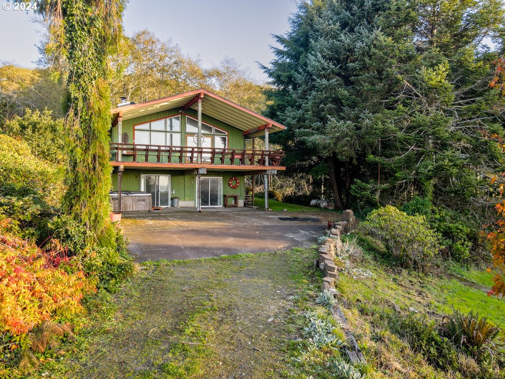 a view of house with yard