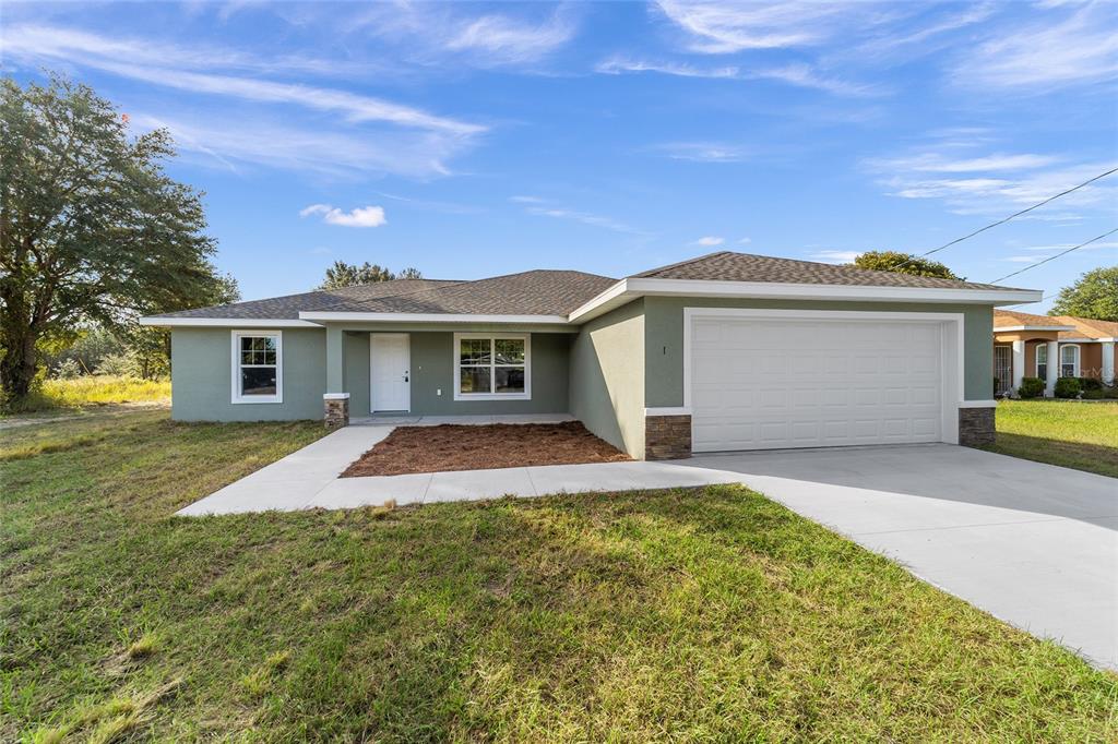 front view of a house with a yard