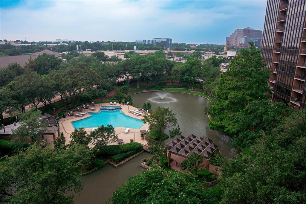 an aerial view of a house with outdoor space and lake view