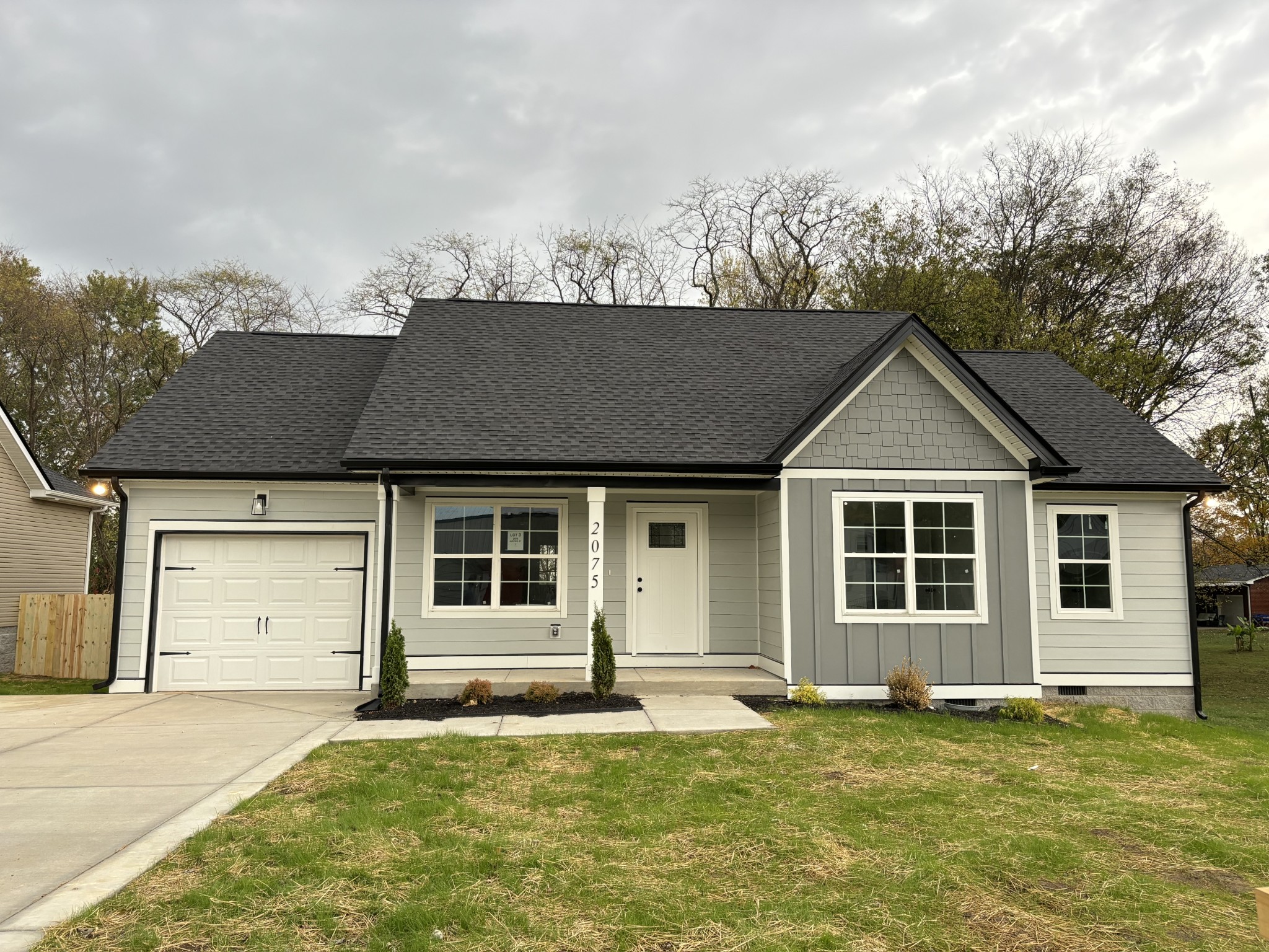 front view of a house with a yard