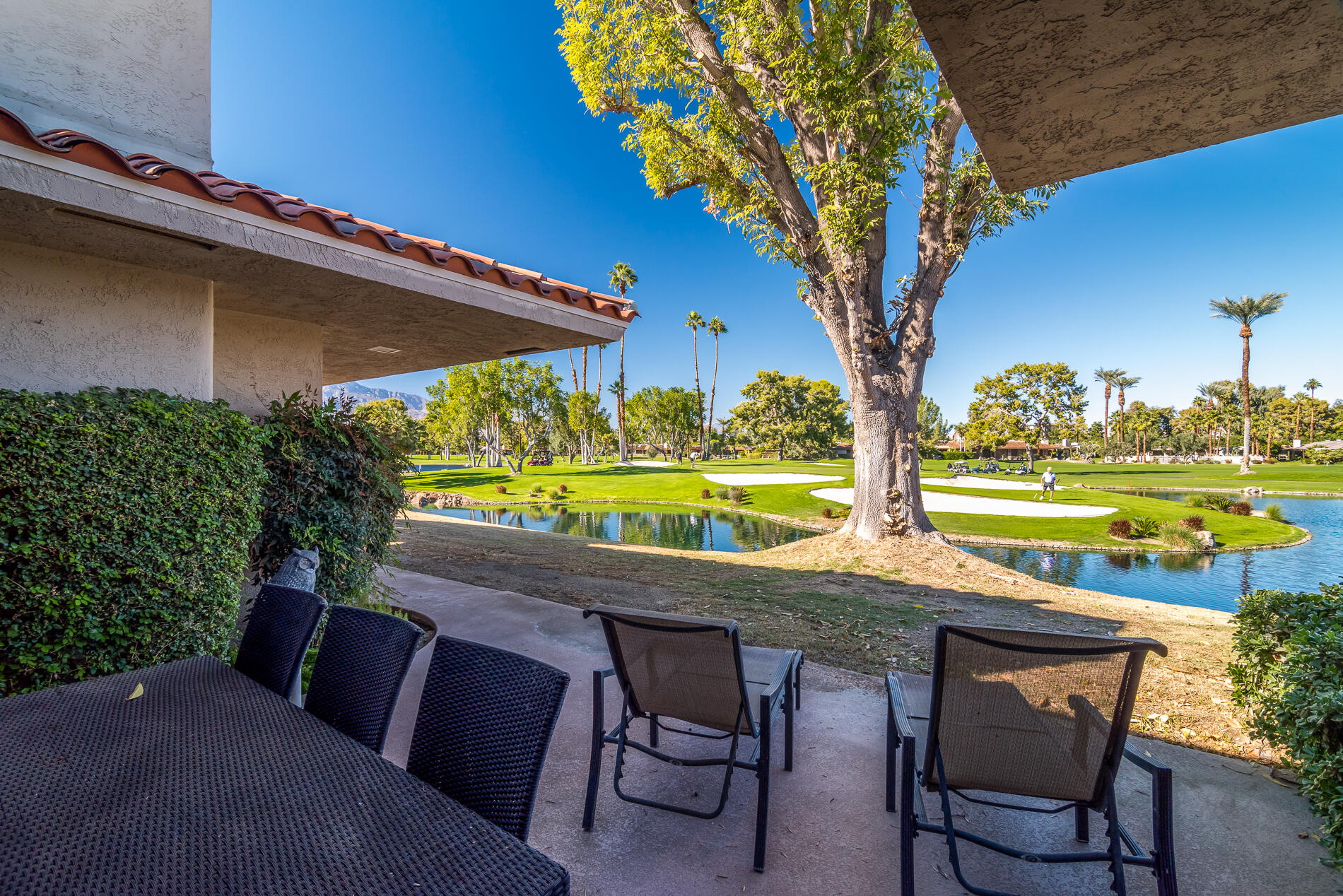 a patio with table and chairs