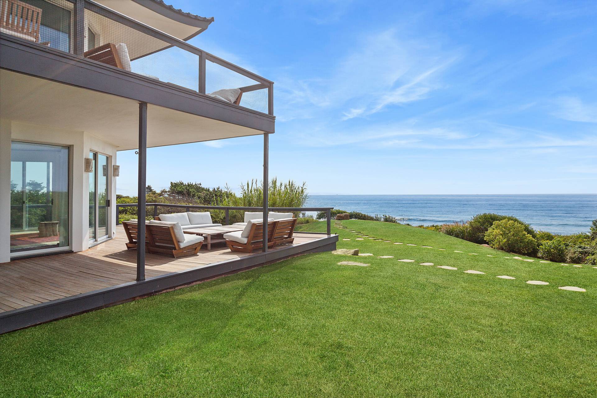 a view of a garden with lawn chairs