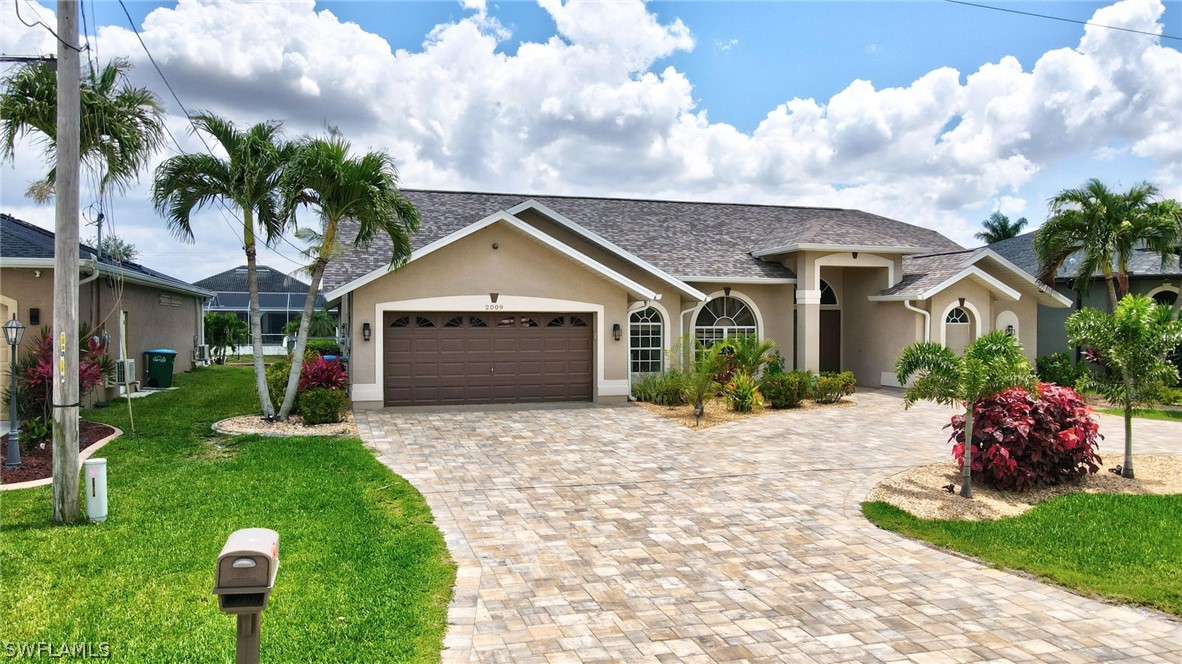 a front view of a house with a yard and porch