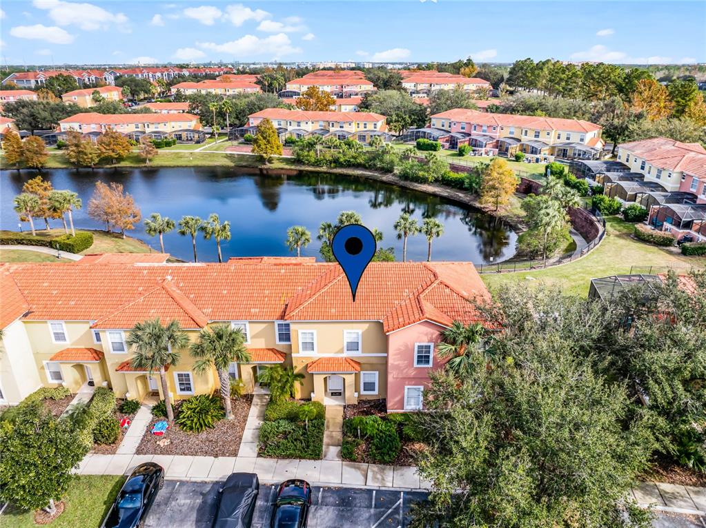 an aerial view of houses with yard