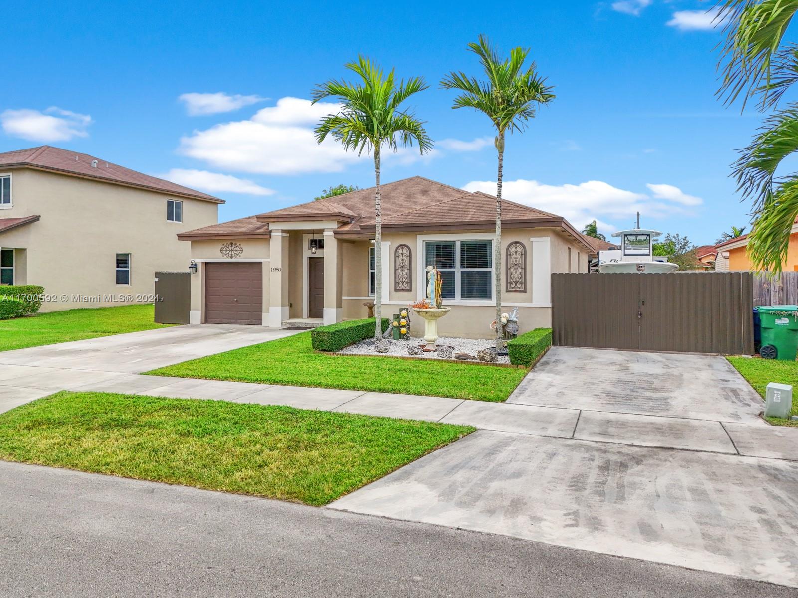 a front view of house with yard and green space