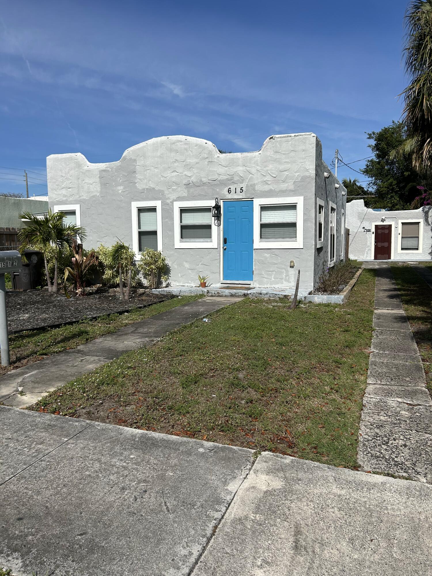 front view of a house with a yard