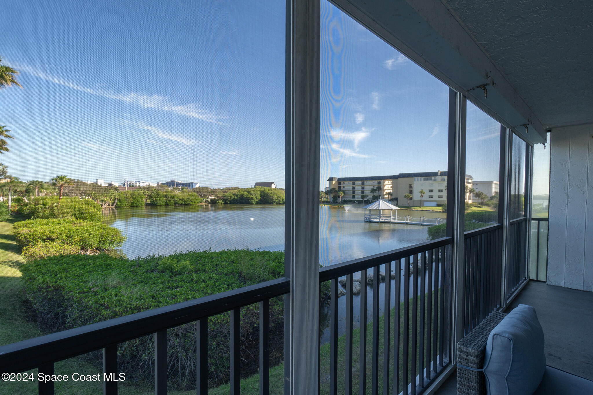 a view of balcony with yard and outdoor seating