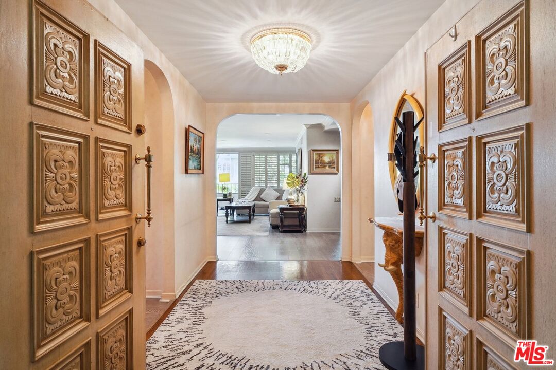 view of a livingroom with furniture a dinning room and stairs