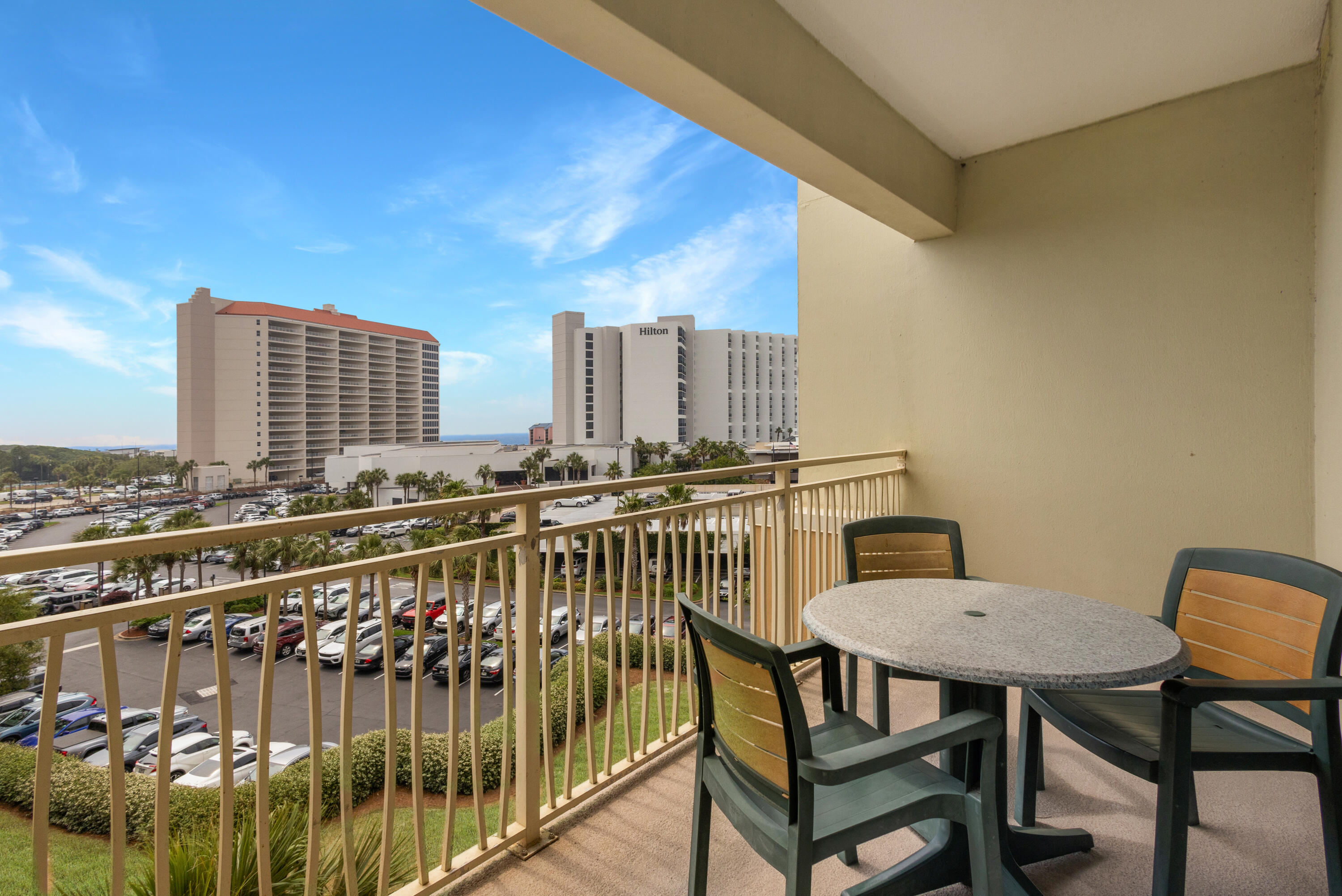 a view of a balcony with chairs