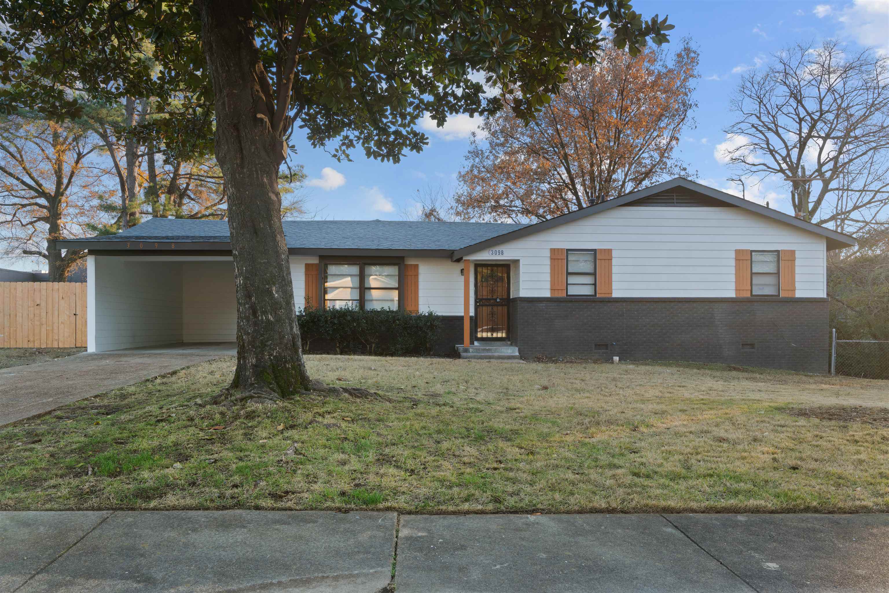 a house with trees in front of it