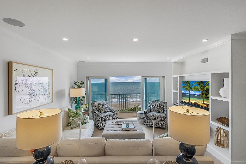 a living room with furniture and a table