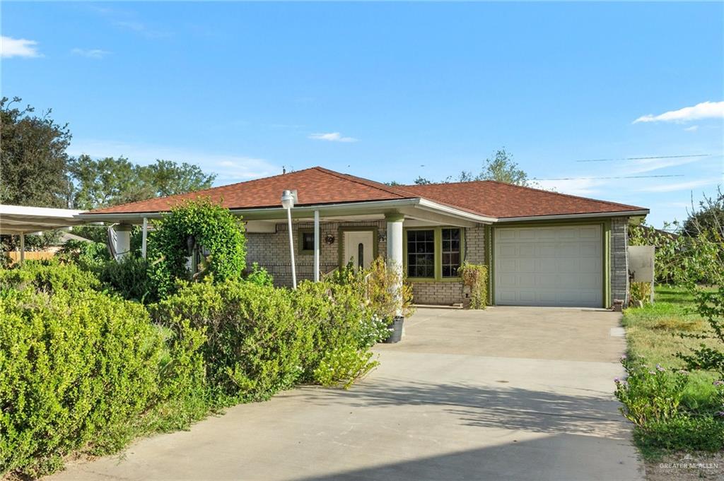 Single story home featuring a garage