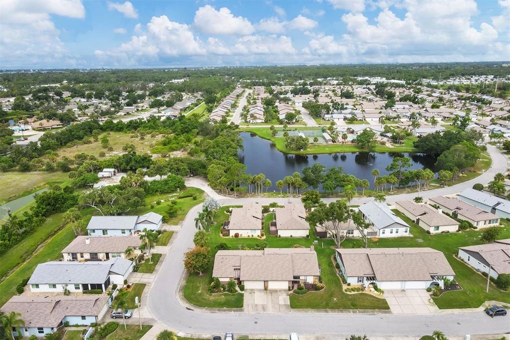 an aerial view of residential houses with outdoor space