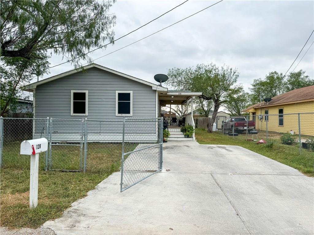 View of home's exterior with a yard