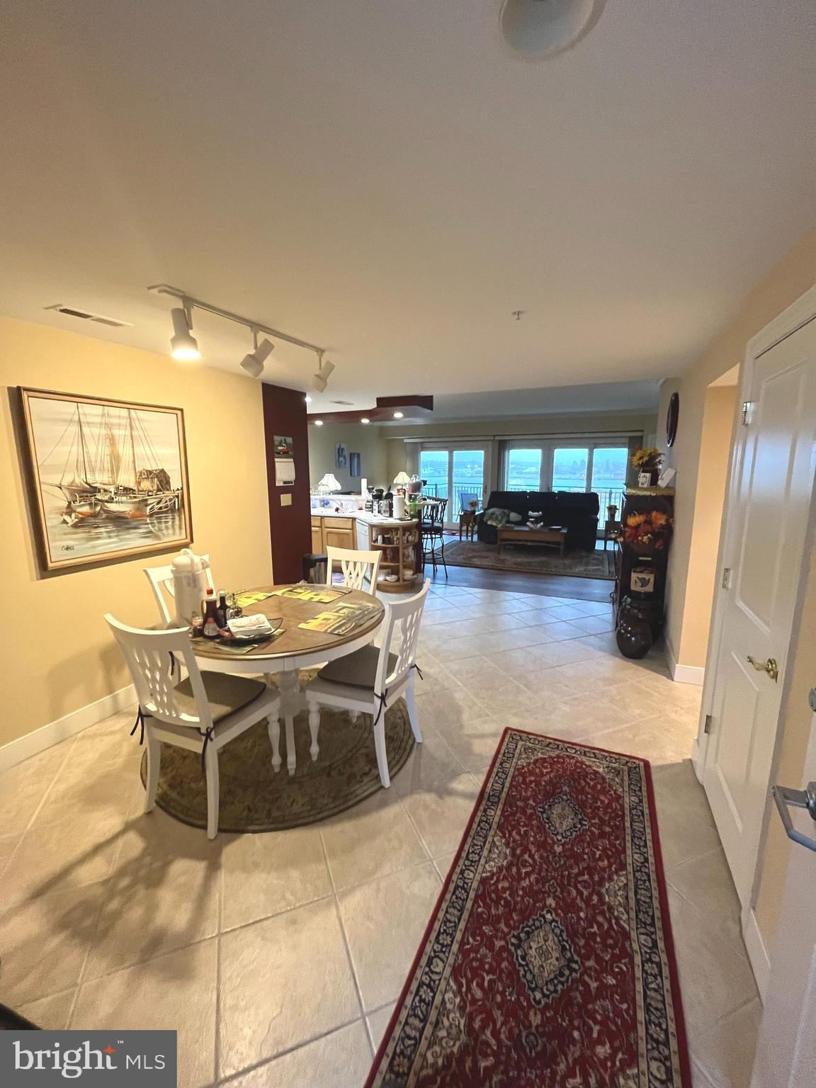 a living room with a couch and a rug