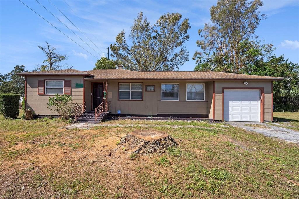 front view of a house with a yard