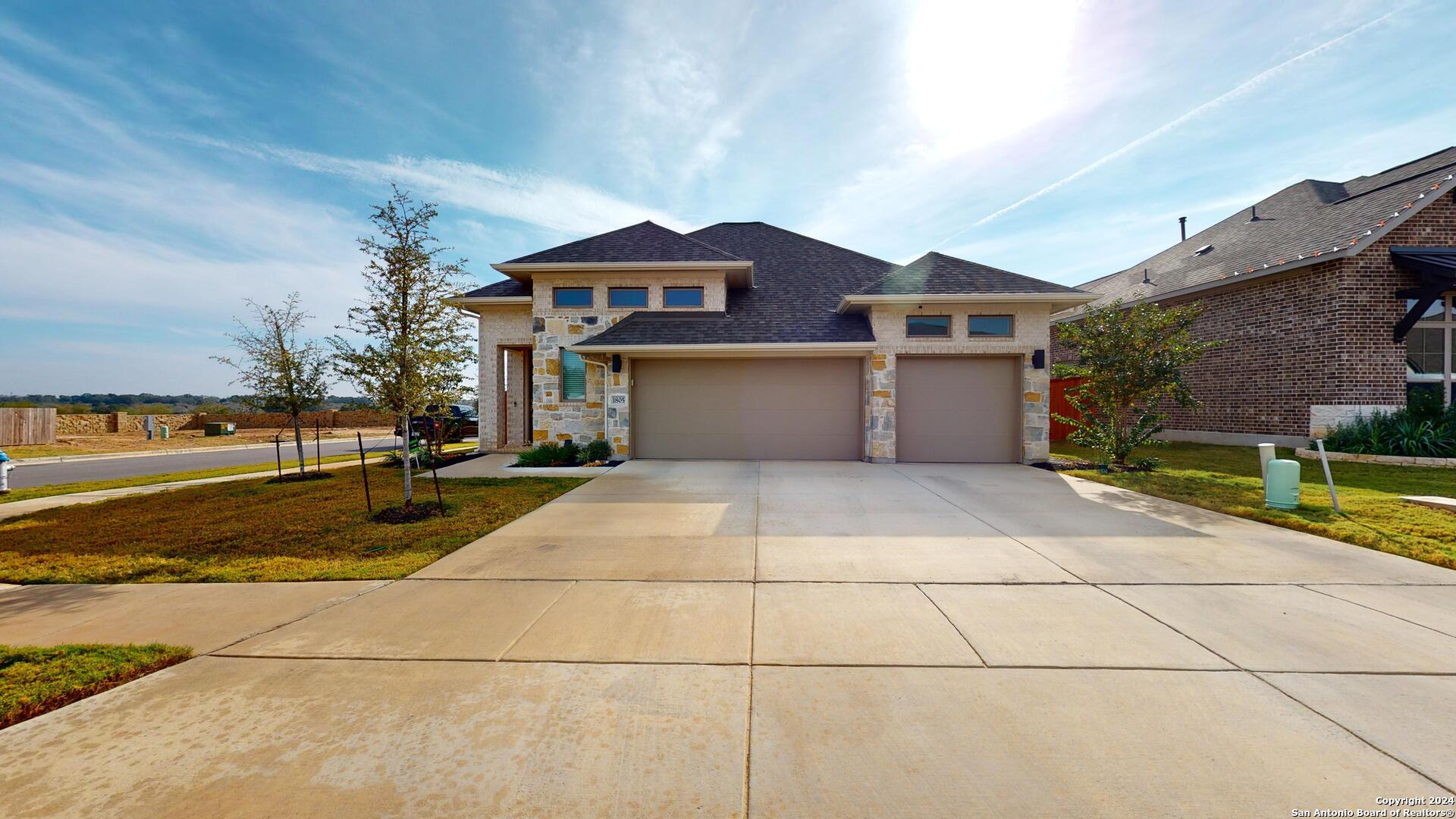 a front view of a house with a yard