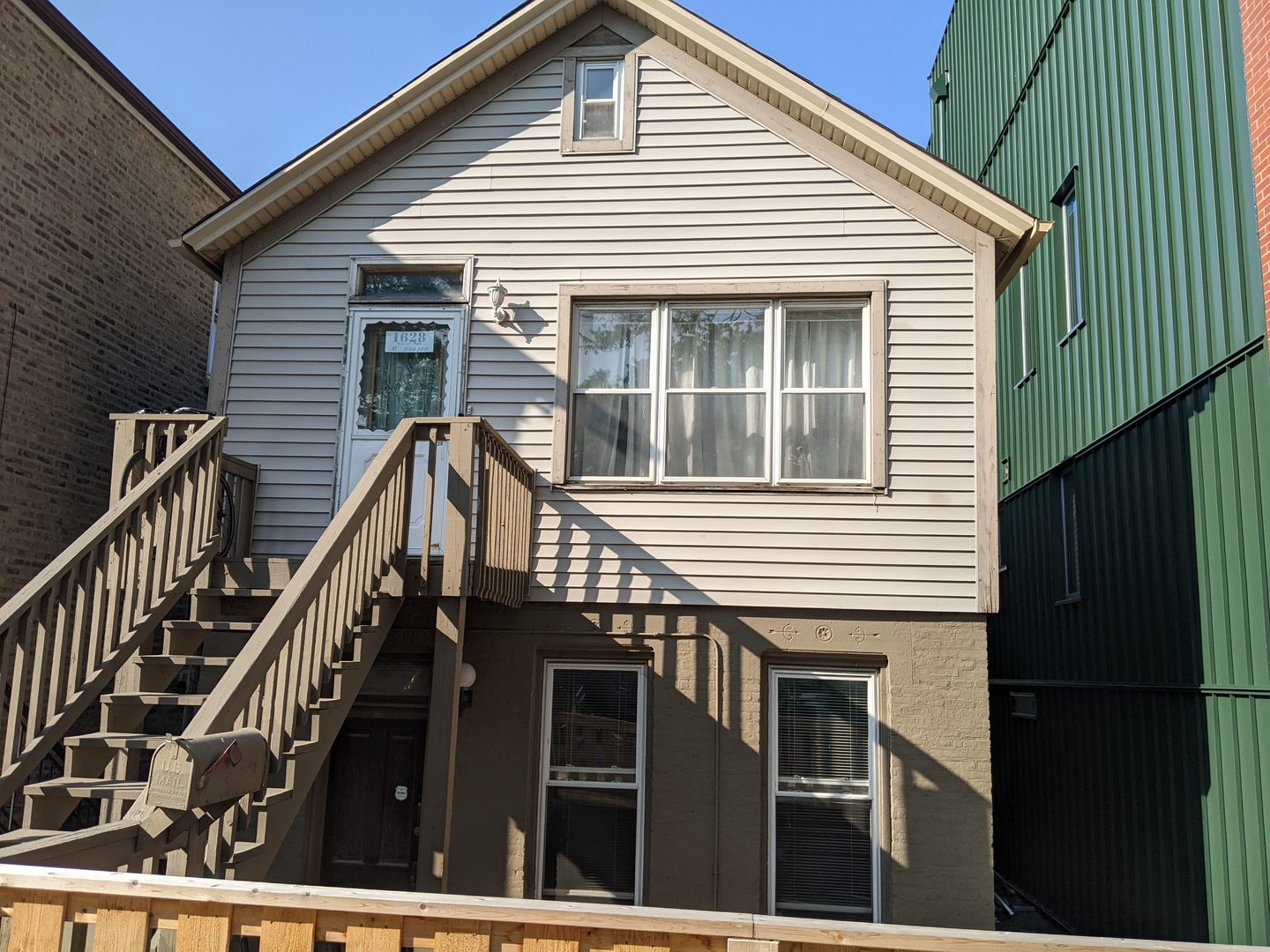 a view of a house with wooden stairs