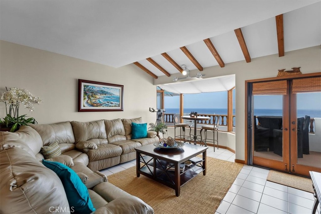 a living room with furniture and a rug