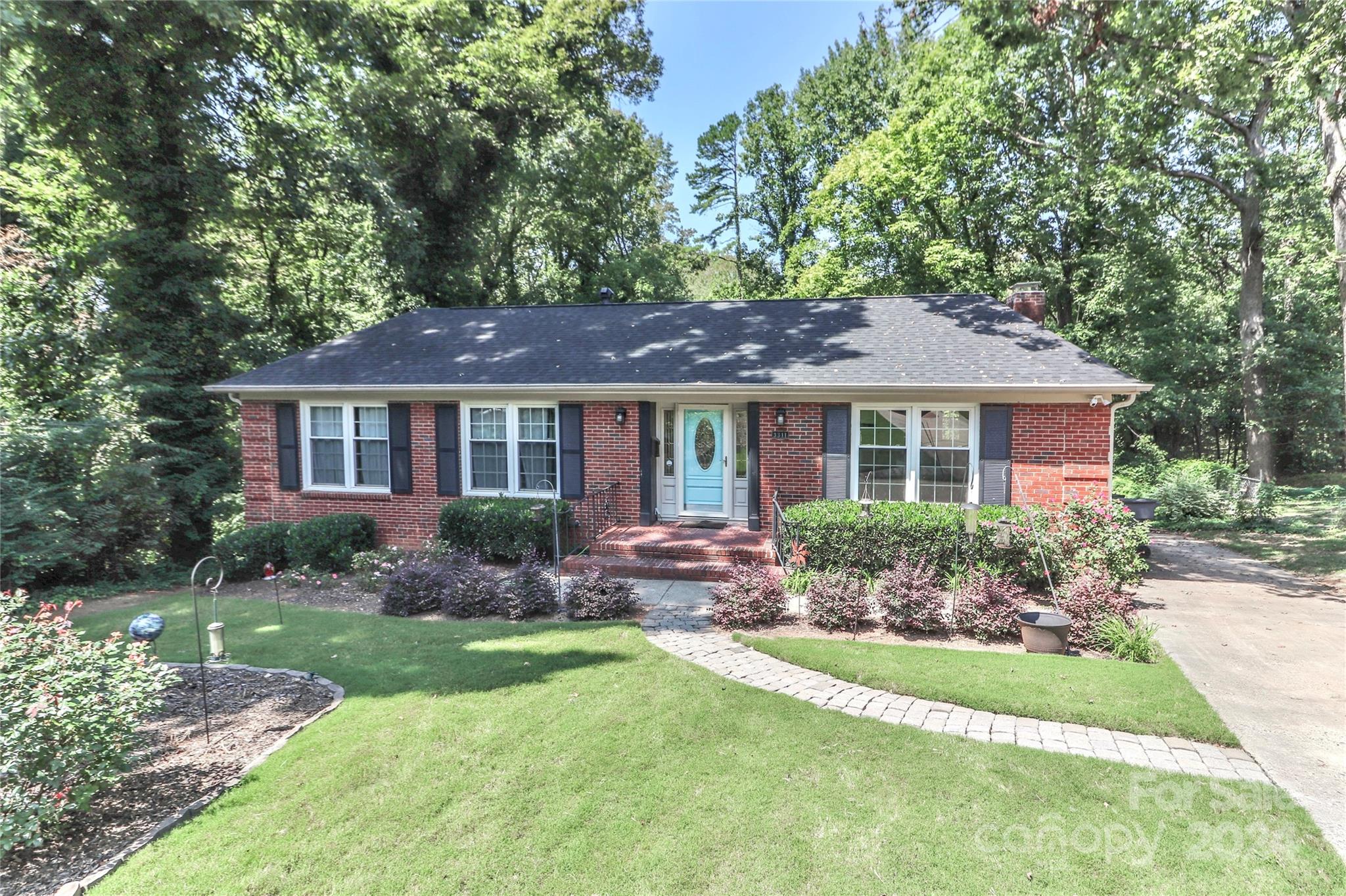 a front view of a house with a yard and porch