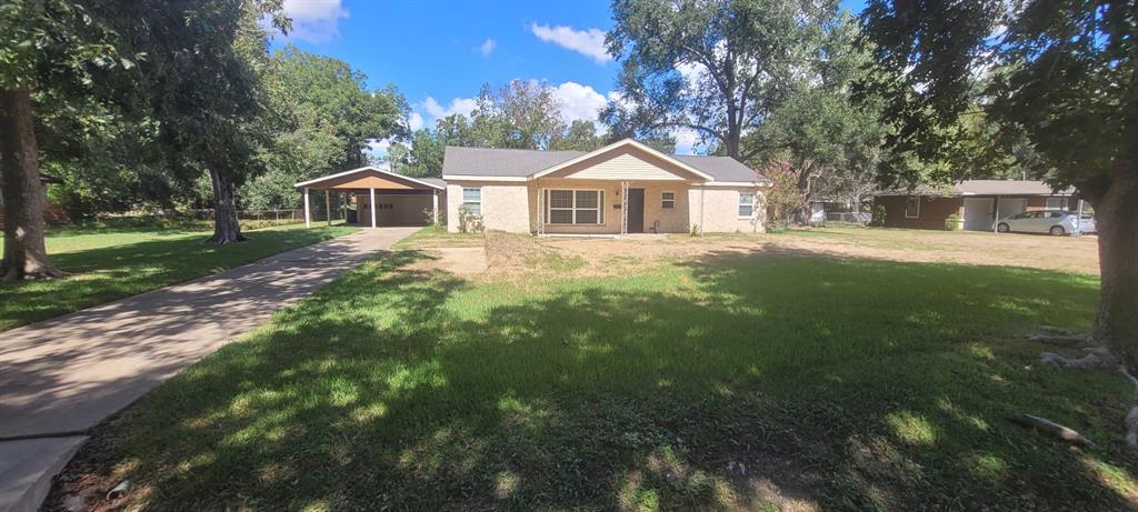 a front view of a house with yard