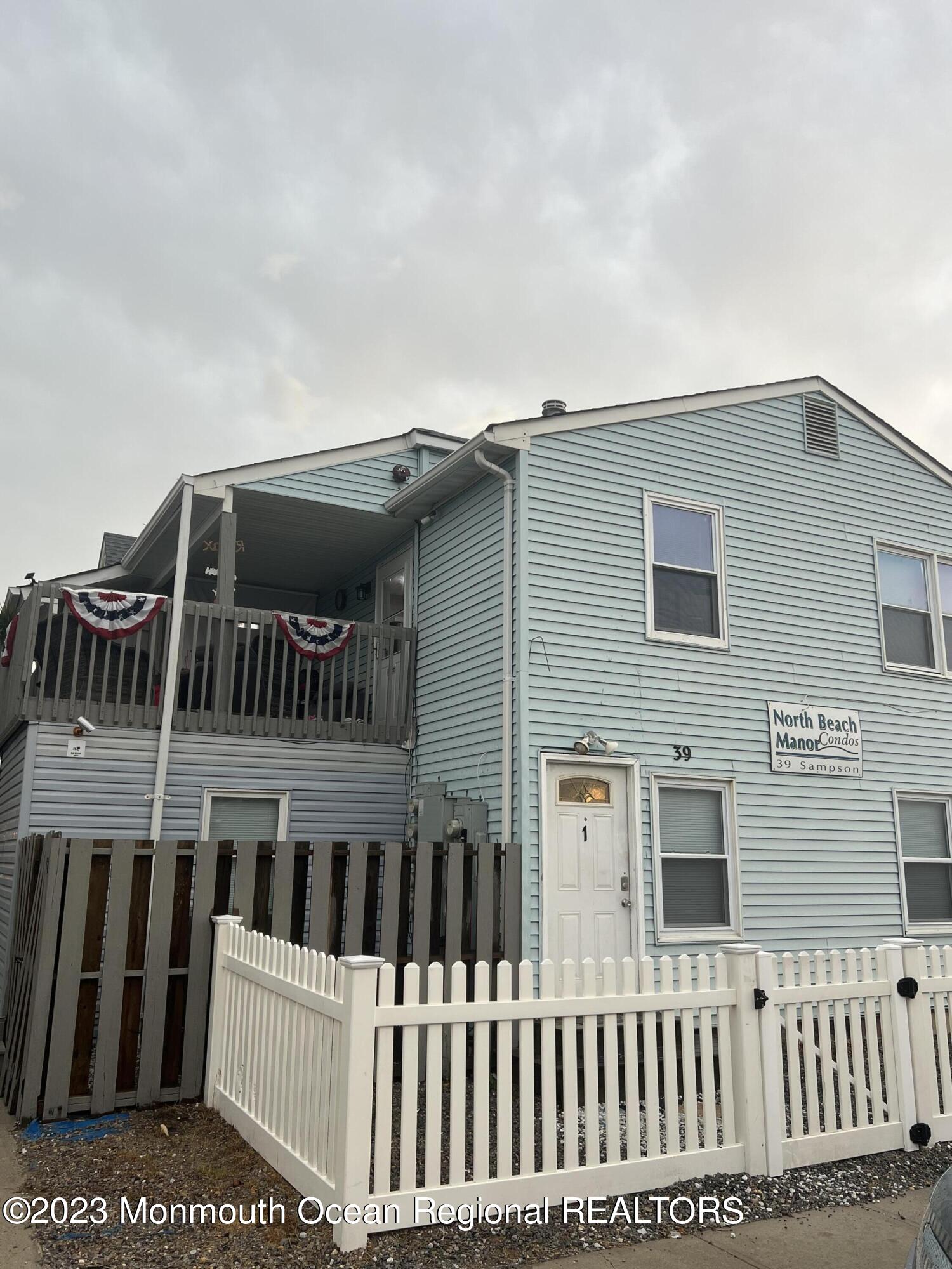 a view of a house with a small yard