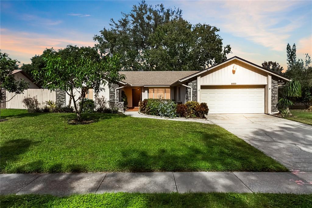 a view of a front of a house with a yard