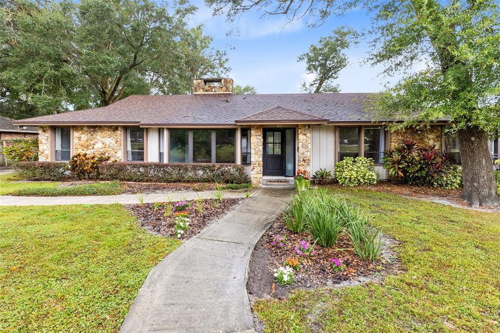 a front view of a house with garden