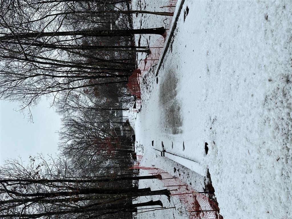 View of yard layered in snow