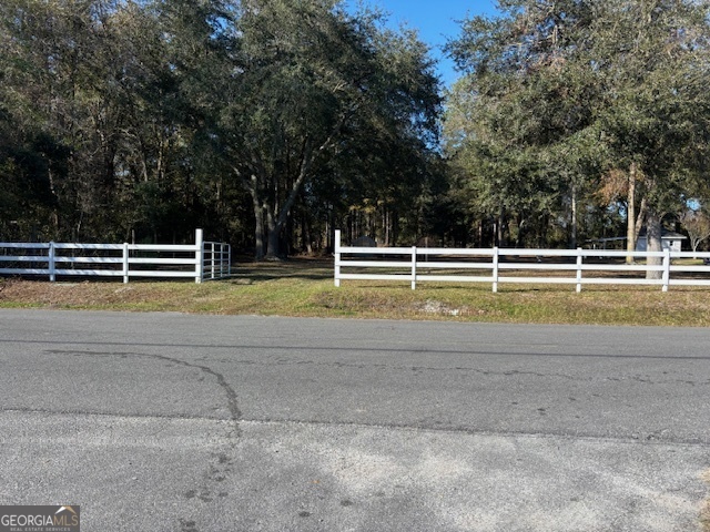 a view of a swimming pool with a yard