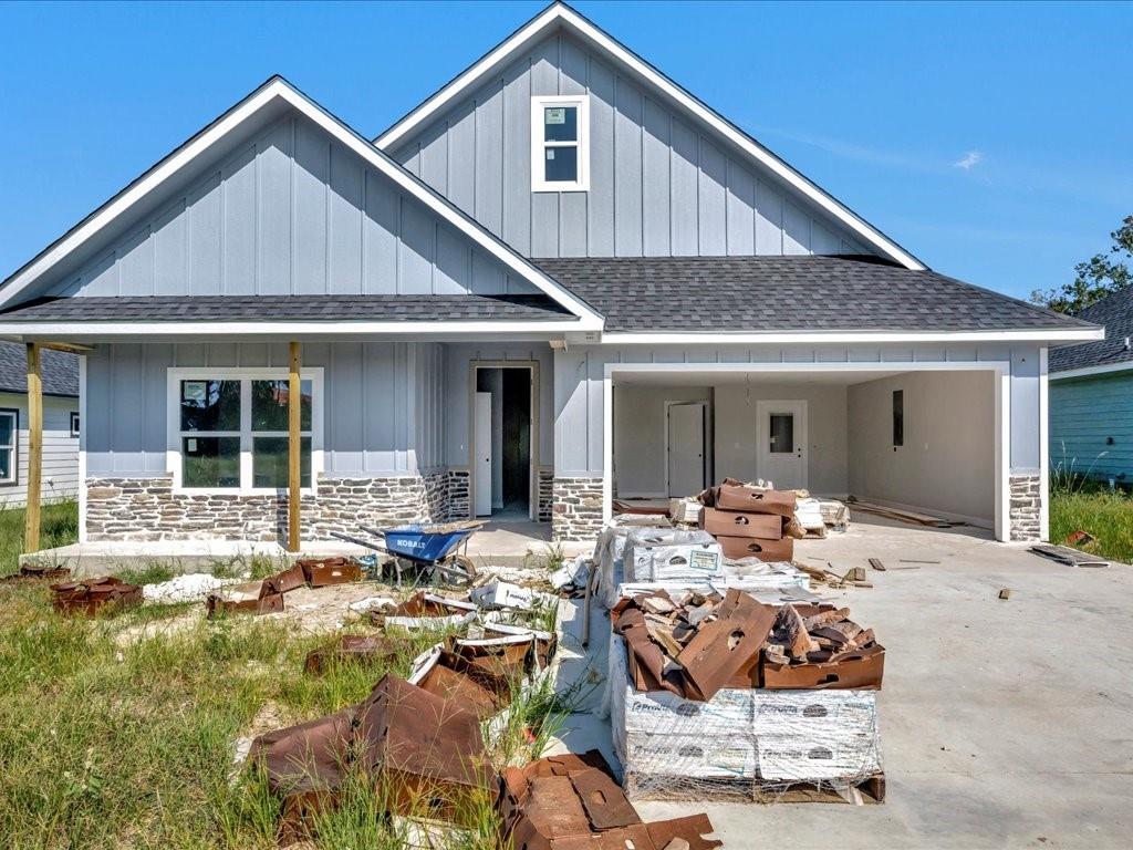 a front view of house with yard outdoor seating and patio