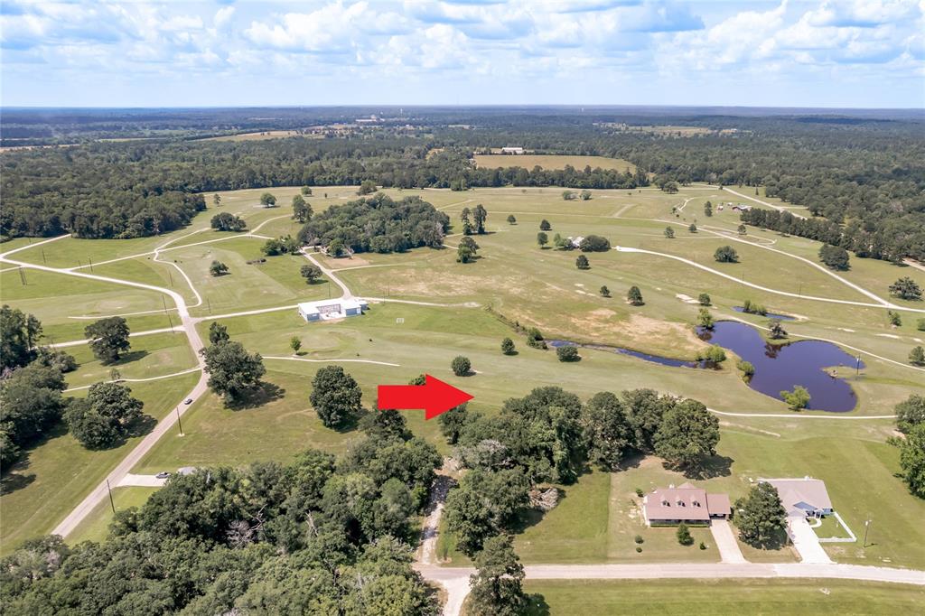 an aerial view of a houses with outdoor space