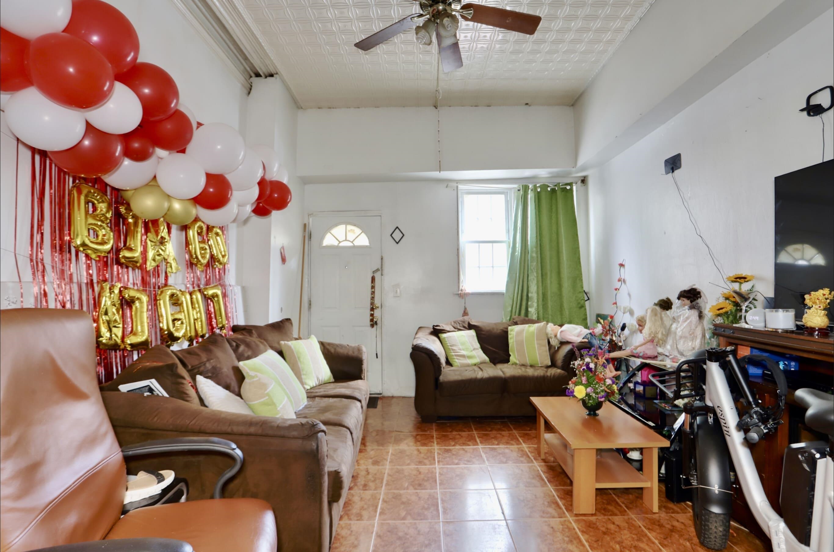 a living room with lots of furniture and a chandelier