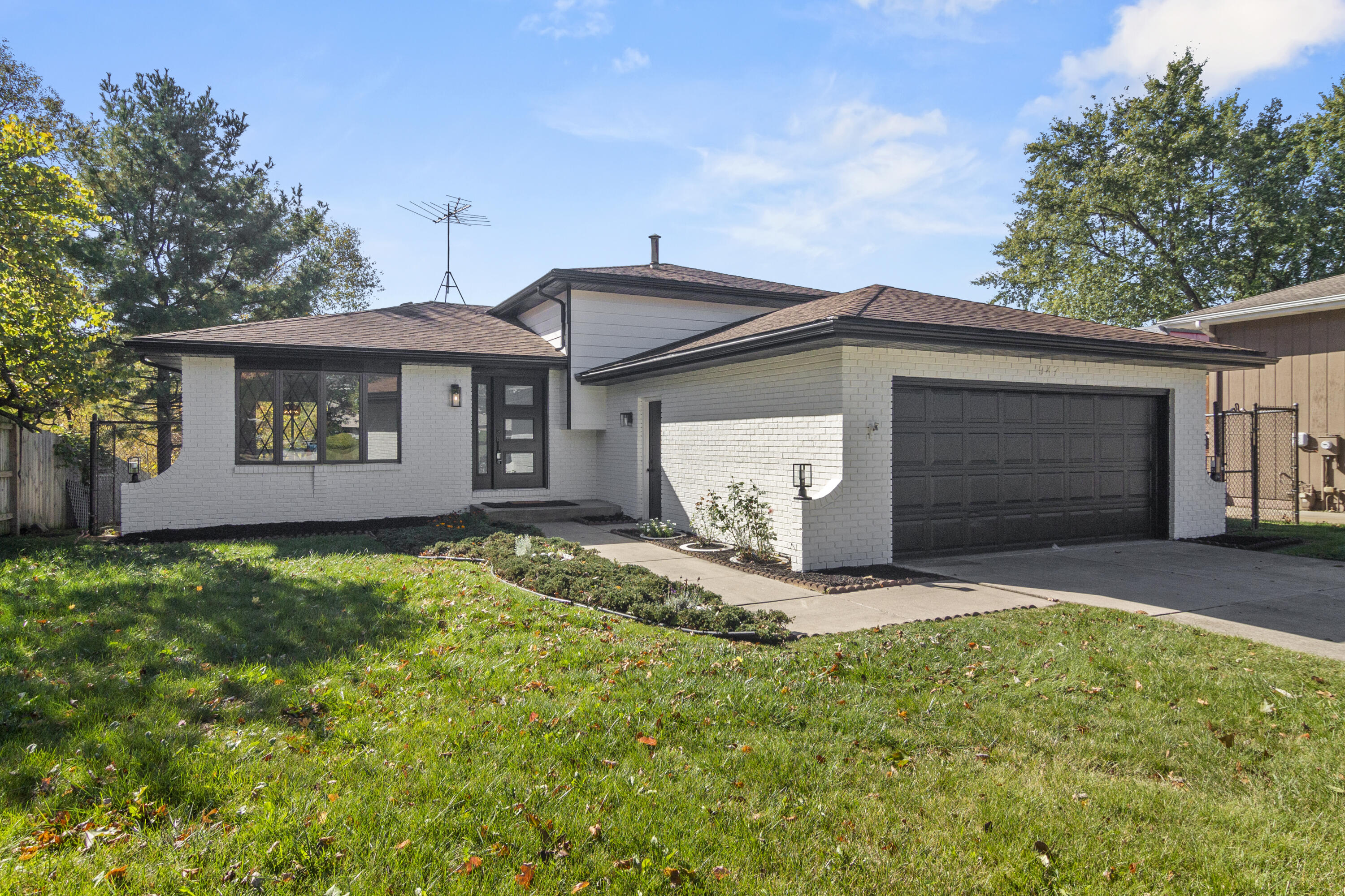 a front view of a house with a garage