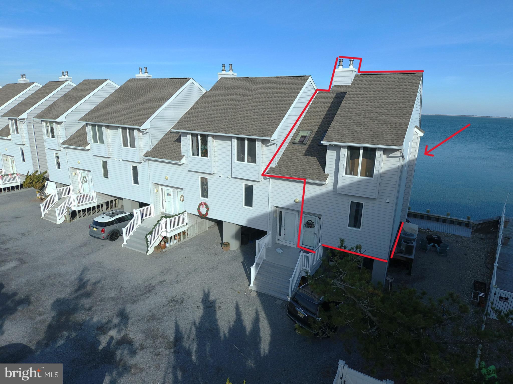 a aerial view of a house with table and chairs