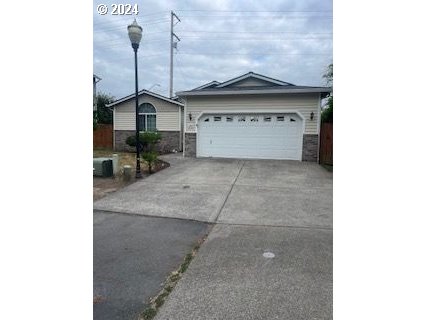 a view of a house with a wooden fence and a window