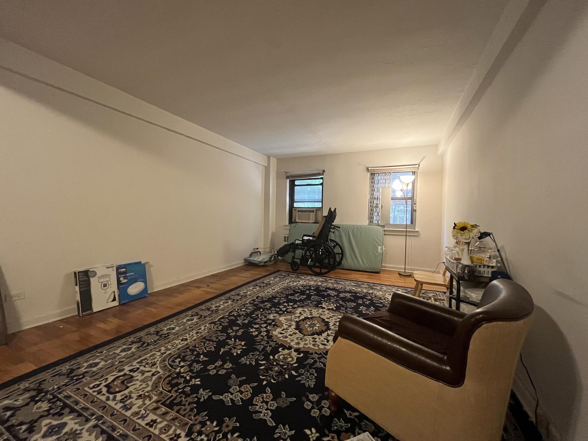 a bed room with furniture and wooden floor