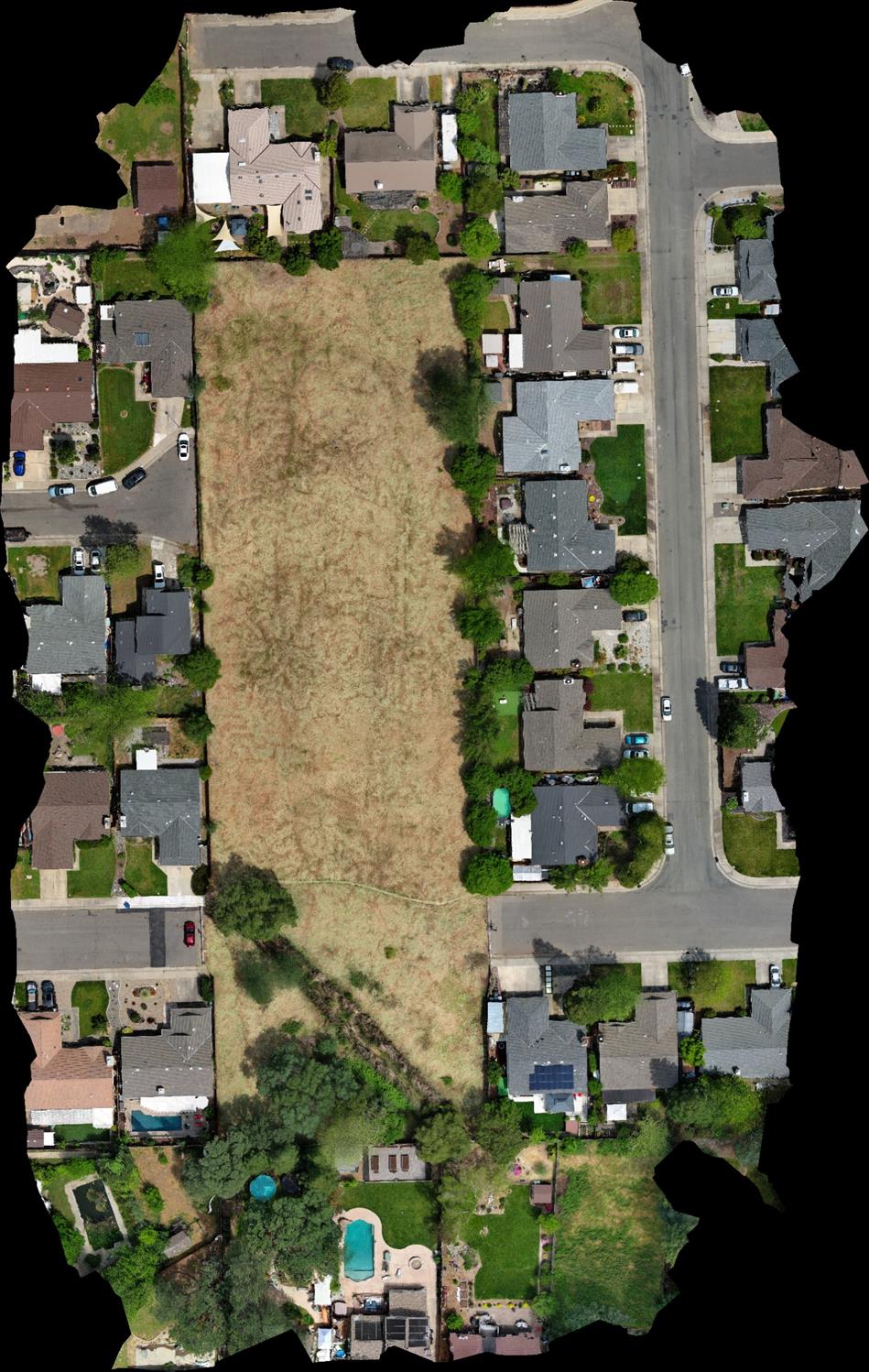 an aerial view of multiple houses with outdoor space