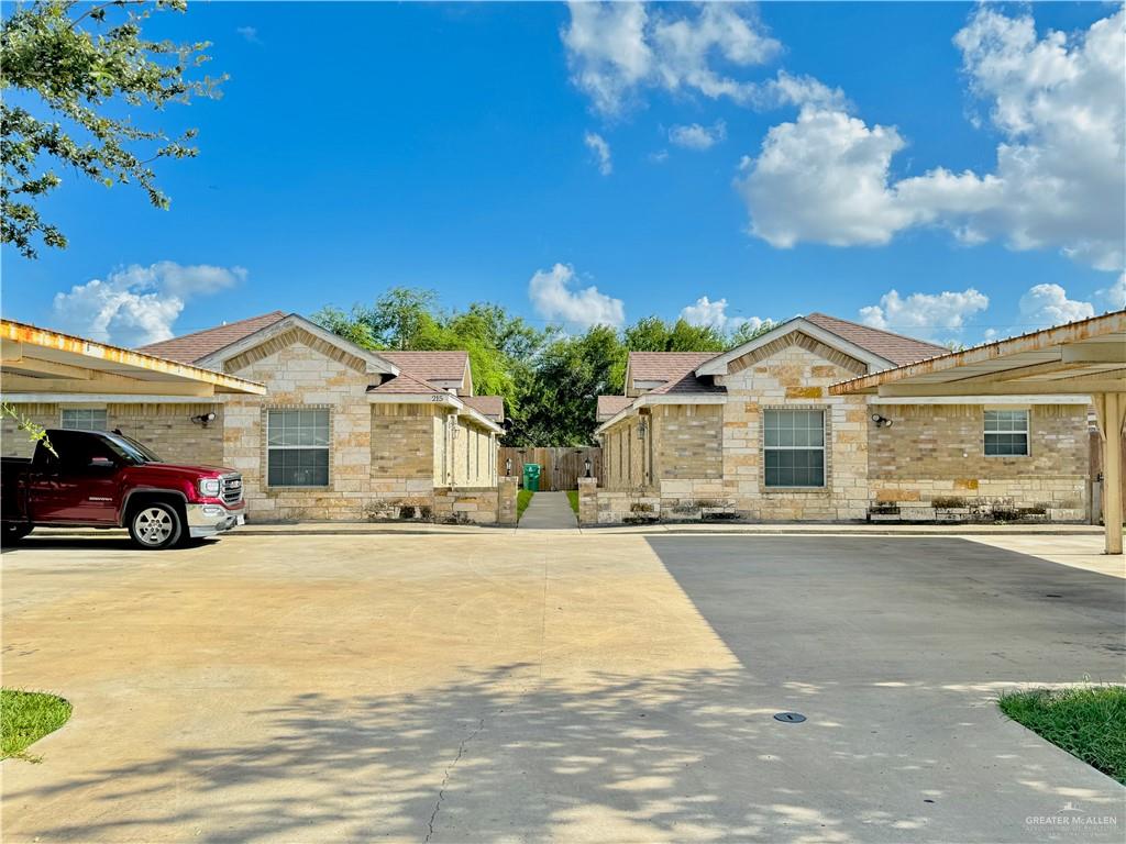 a view of a car park in front of house