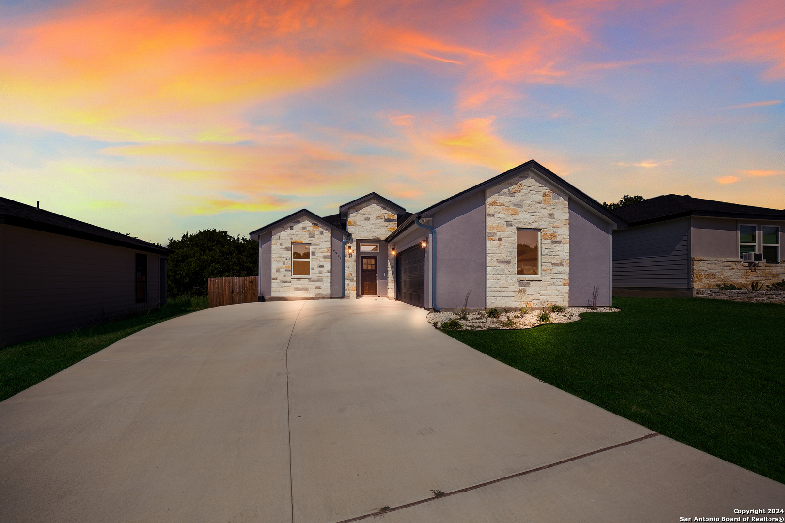 a front view of a house with a yard