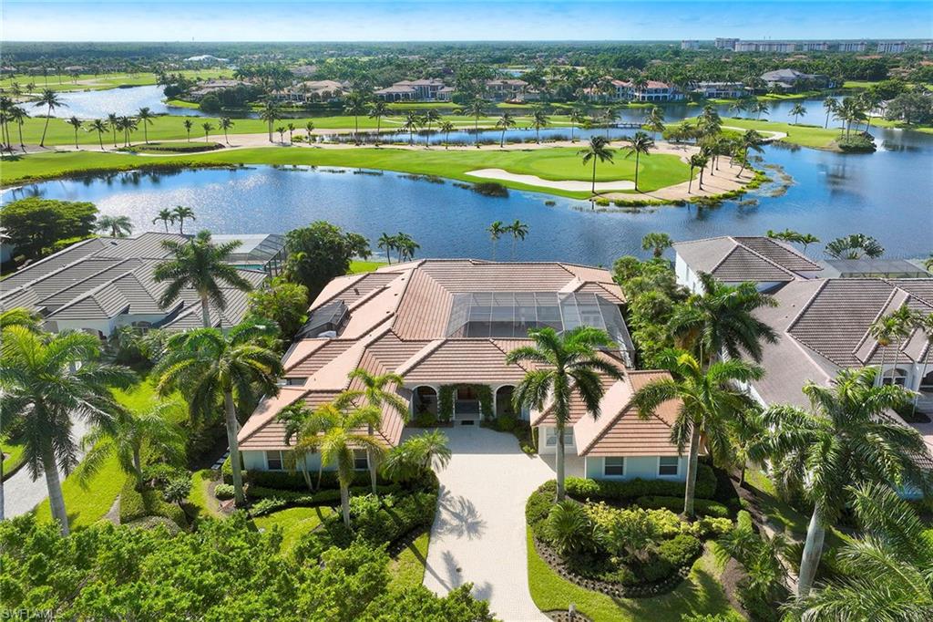 an aerial view of a house with a swimming pool yard and outdoor seating