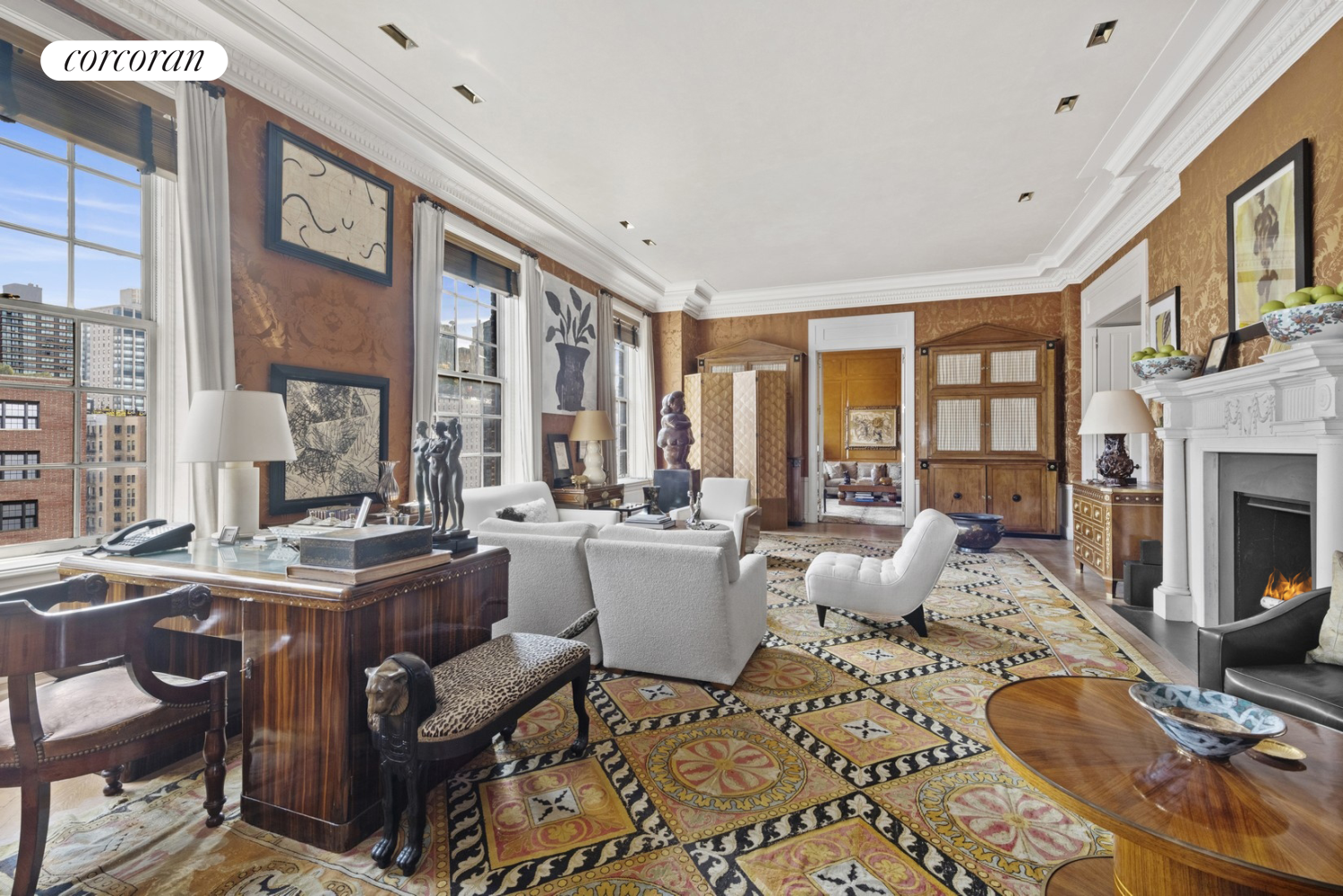 a living room with fireplace furniture and a large window