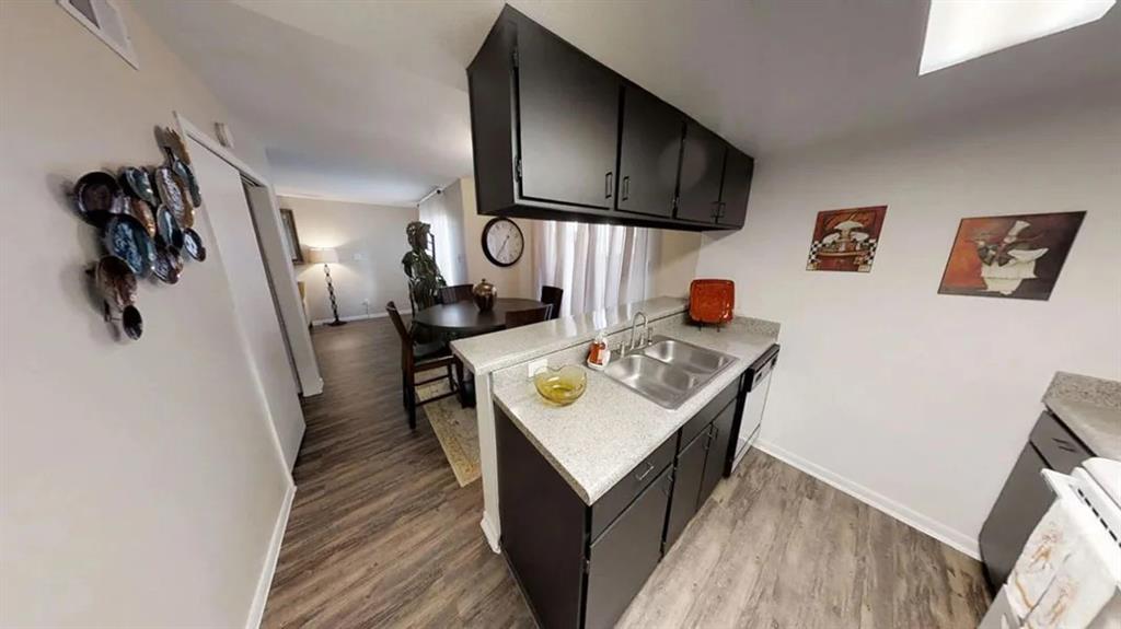 a view of a kitchen area with stainless steel appliances a stove and a refrigerator